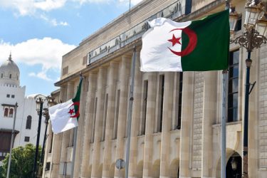 Algerian flags flutter in front of the People's National Assembly (parliament) building in the capital Algiers, on September 10, 2020. (Photo by RYAD KRAMDI / AFP) (Photo by RYAD KRAMDI/AFP via Getty Images)